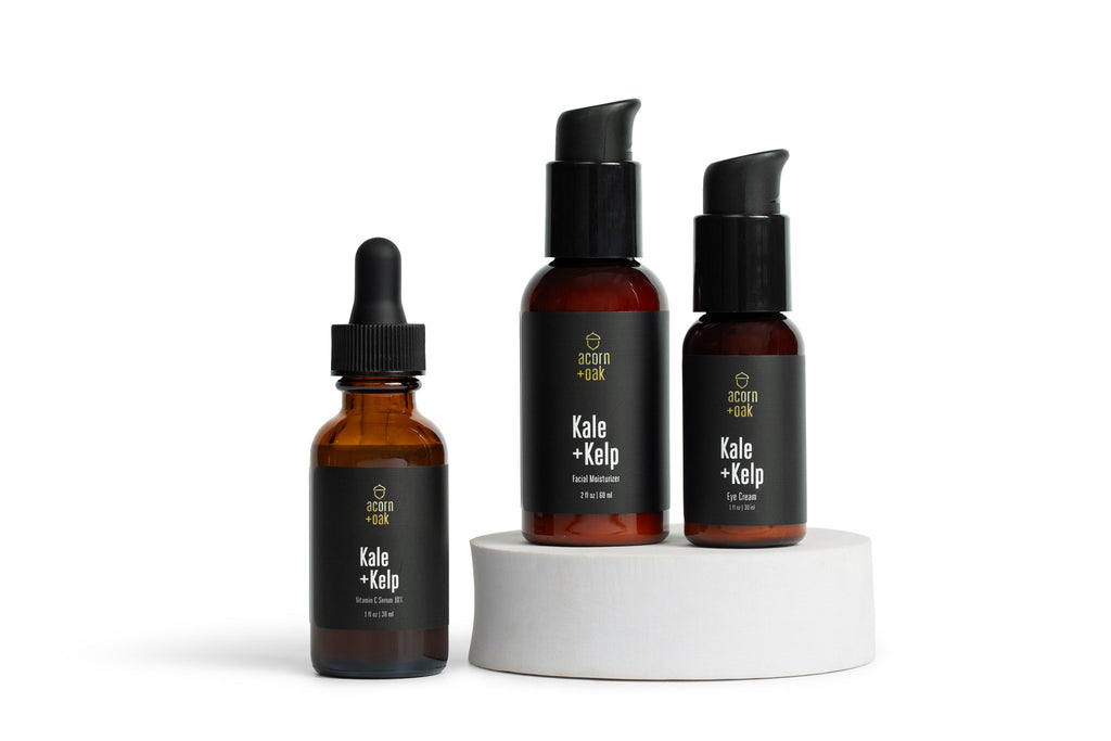 Three bottles of acorn+oak skincare products on a white background