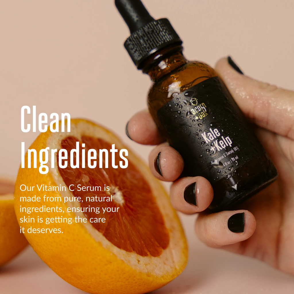 acorn+oak vitamin c serum held by a hand with an orange half in the background, text about clean ingredients.